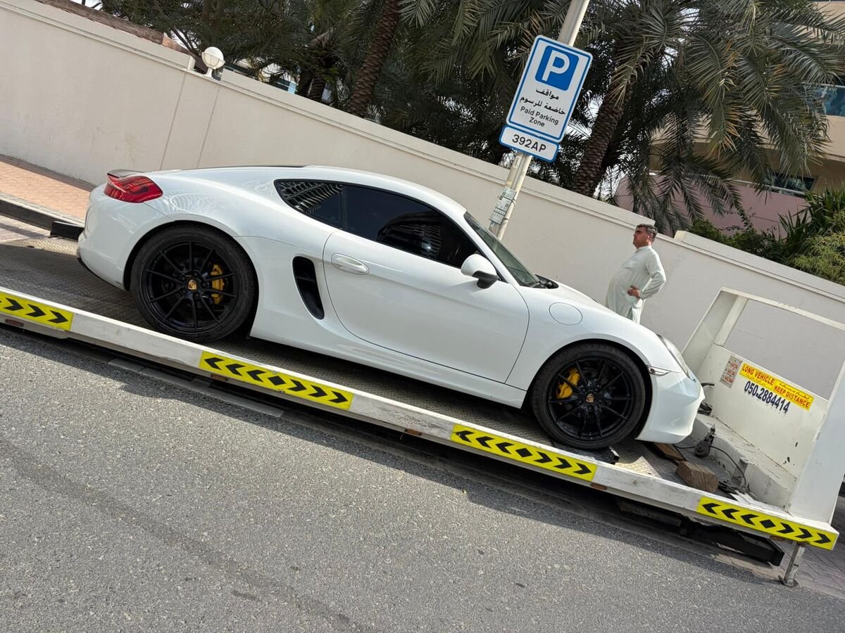 Porsche Cayman loaded on recovery truck Dubai