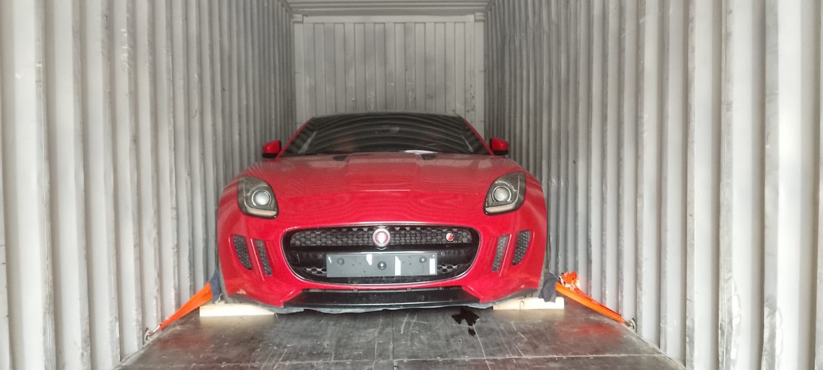 Alfa Romeo, red, in transit to Europe