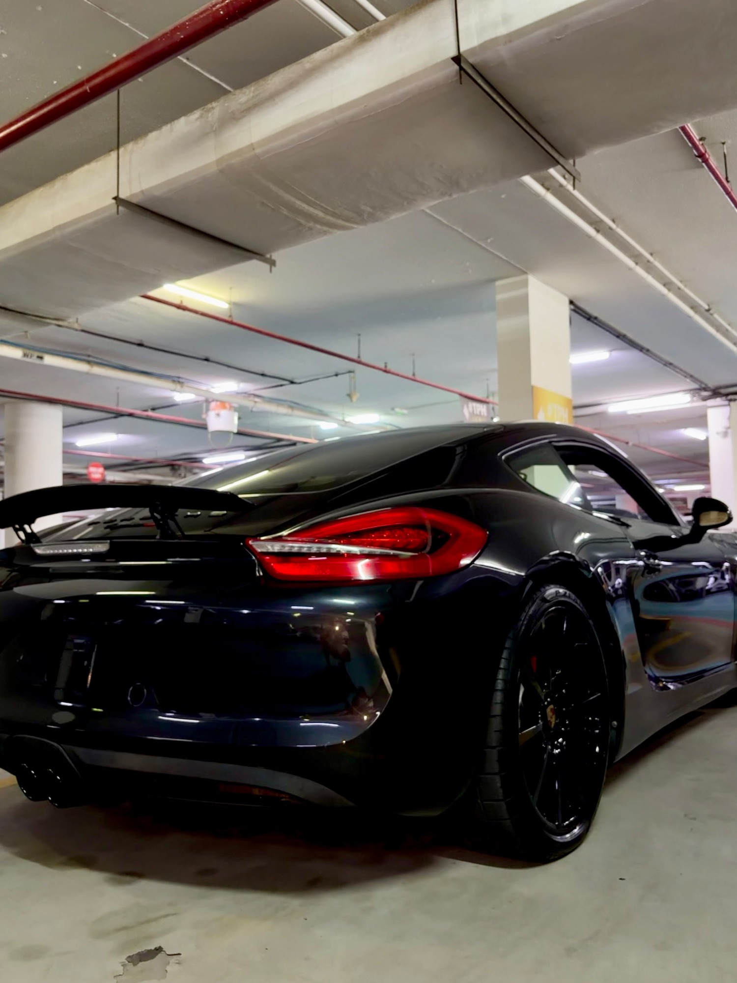 Porsche Cayman GTS black, front close-up